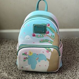 Disney loungefly. Leather mini book bag, Dumbo themed. Brand new, never used.